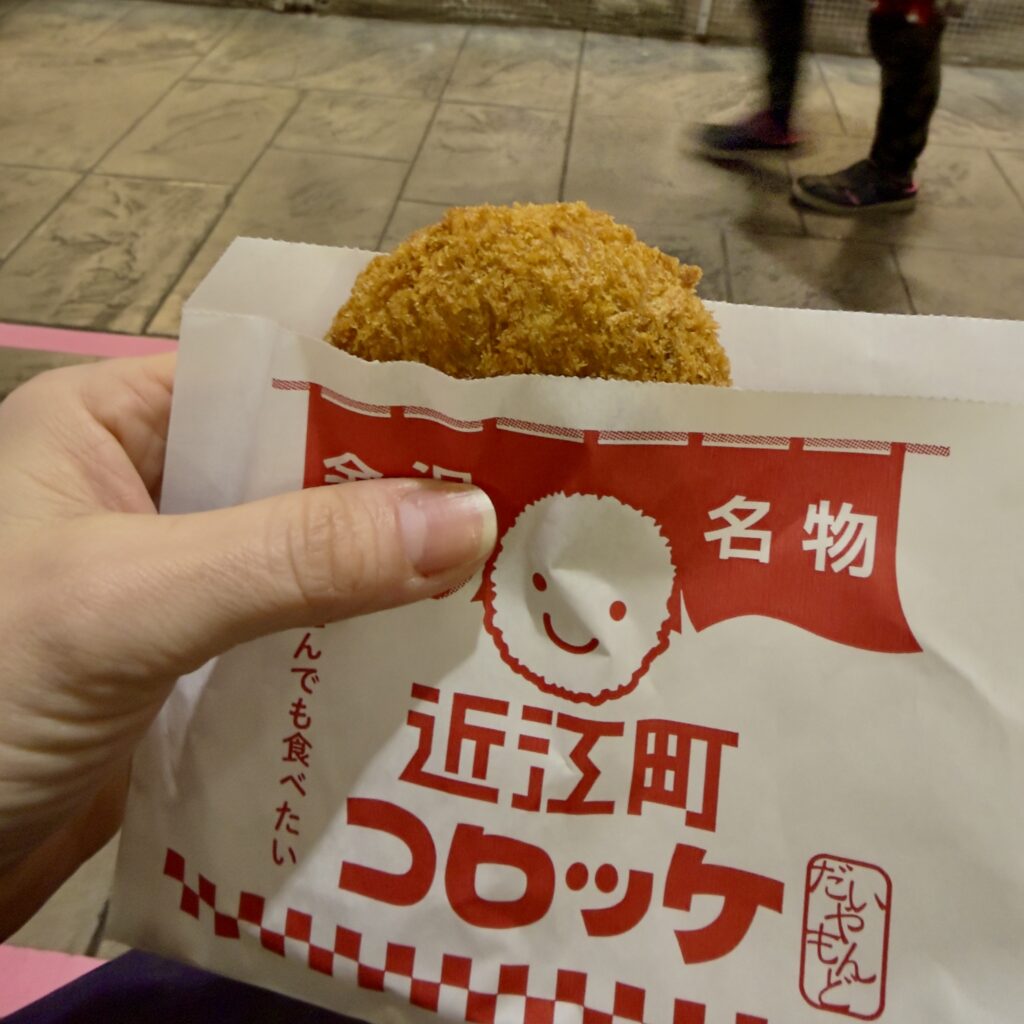 Fresh crab croquettes at Omicho Ichiba market in Kanazawa, Japan