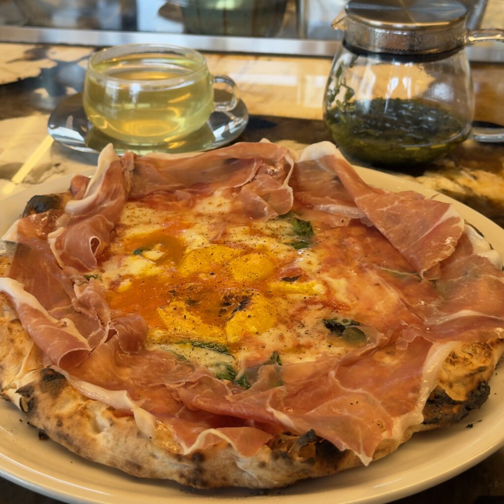 Wood-fired pizza fresh from the oven at Pizza Marumo in Ebisu, Tokyo