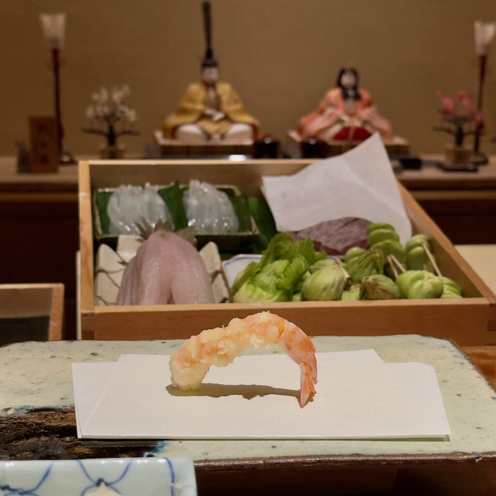 Tempura being prepared at the counter at Tempura Motoyoshi, a two-Michelin-starred restaurant in Ebisu, Tokyo