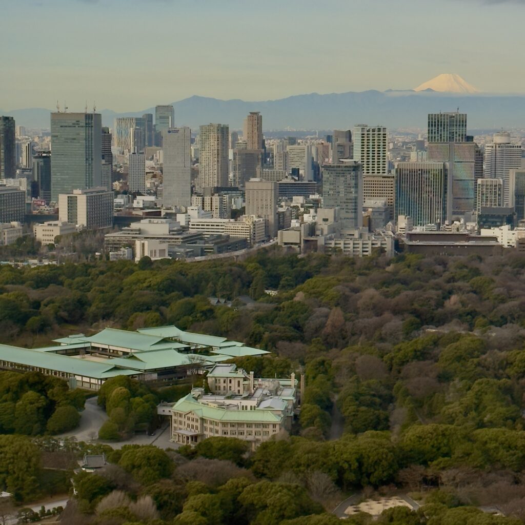 The Imperial Palace in Tokyo with Mount Fuji visible in the background against a clear sky