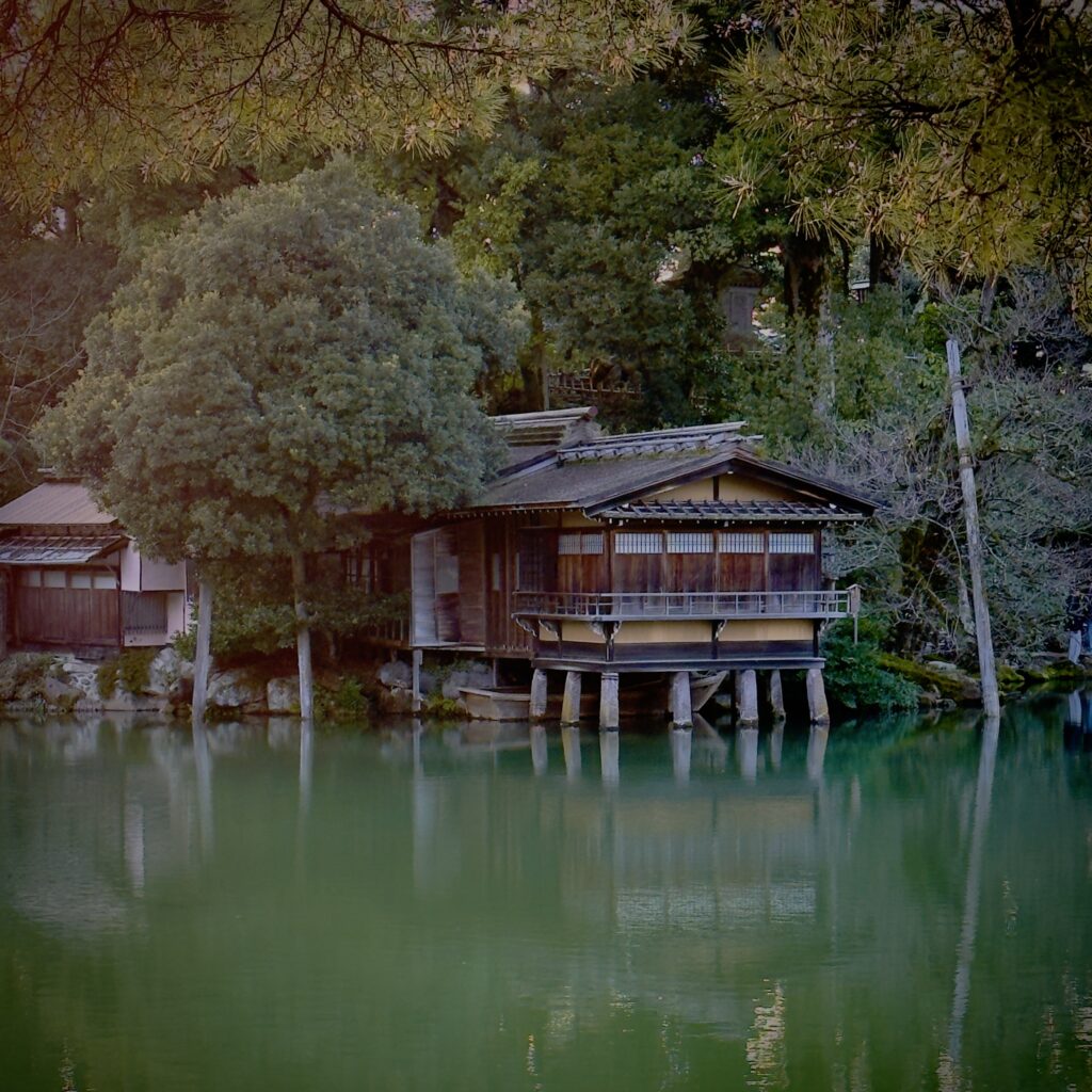 Historic Uchihashi-tei teahouse overlooking Kasumiga-ike pond inside Kenroku-en garden, Kanazawa