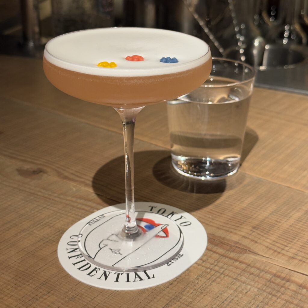 The 300-year-old reclaimed shrine wood bar top at Tokyo Confidential, a lively cocktail bar in Azabu-Juban, Tokyo