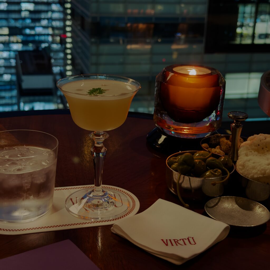 Art Deco interior and city views at Virtù, the World's 50 Best cocktail bar on the 39th floor of the Four Seasons Hotel Tokyo at Otemachi