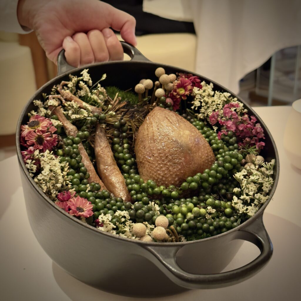 Elegant pigeon presentation at Odette, three-Michelin-star French restaurant inside the National Gallery Singapore